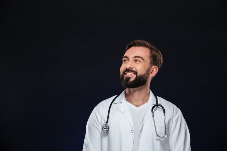 Doctor reviewing patient information in a modern medical consultation room, representing GESY and private healthcare options in Cyprus.