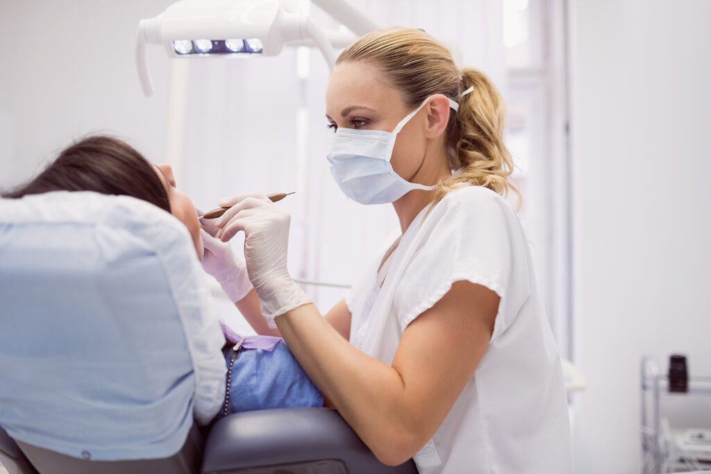 Dentist examining a patient's teeth