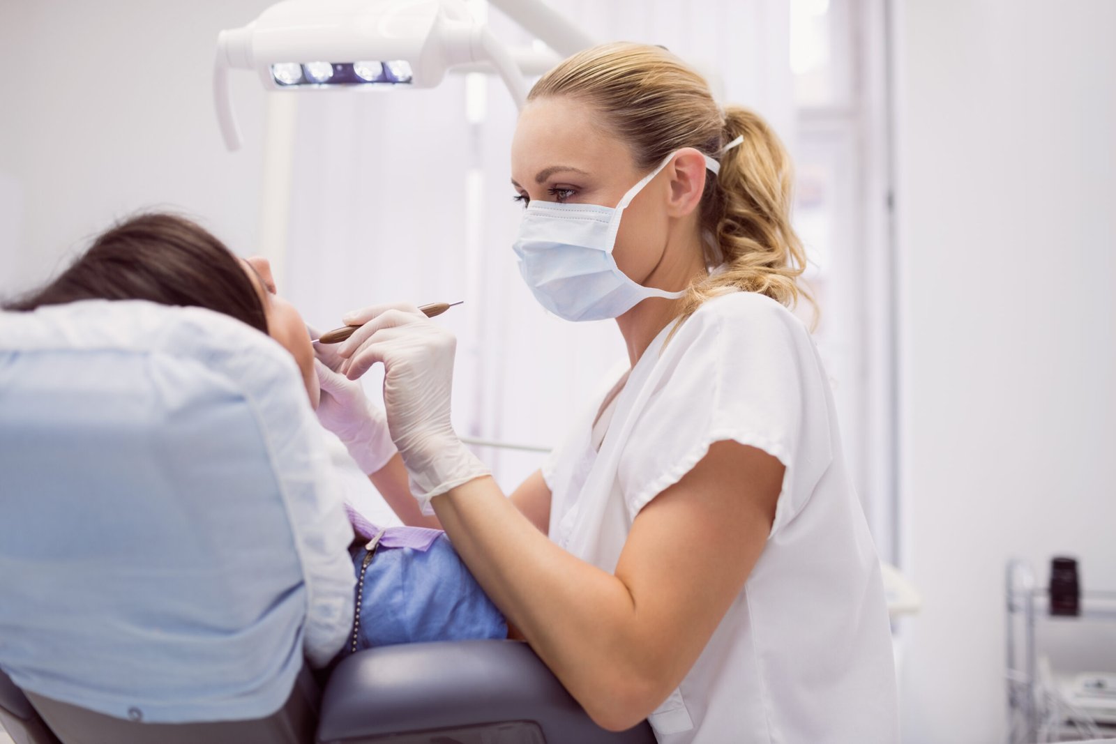 Dentist examining a patient's teeth