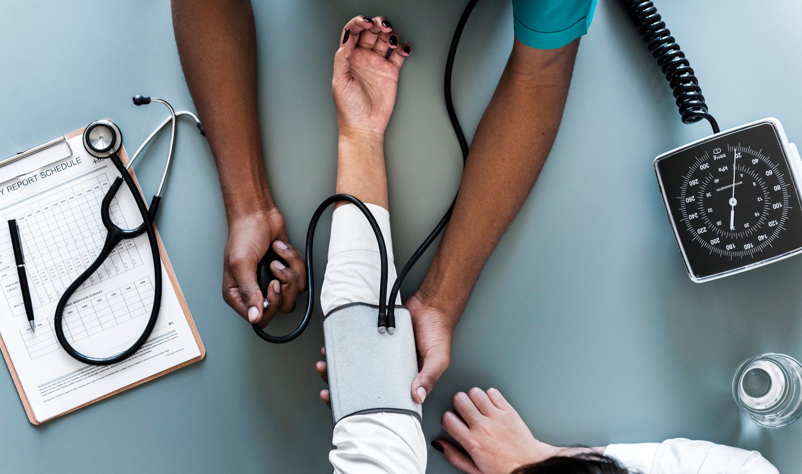 Healthcare professional measuring a patient's blood pressure