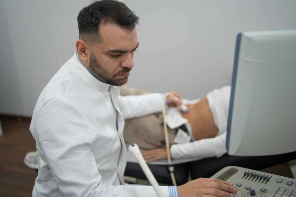 Dr Christos Roukoudis performing an ultrasound examination at his practice
