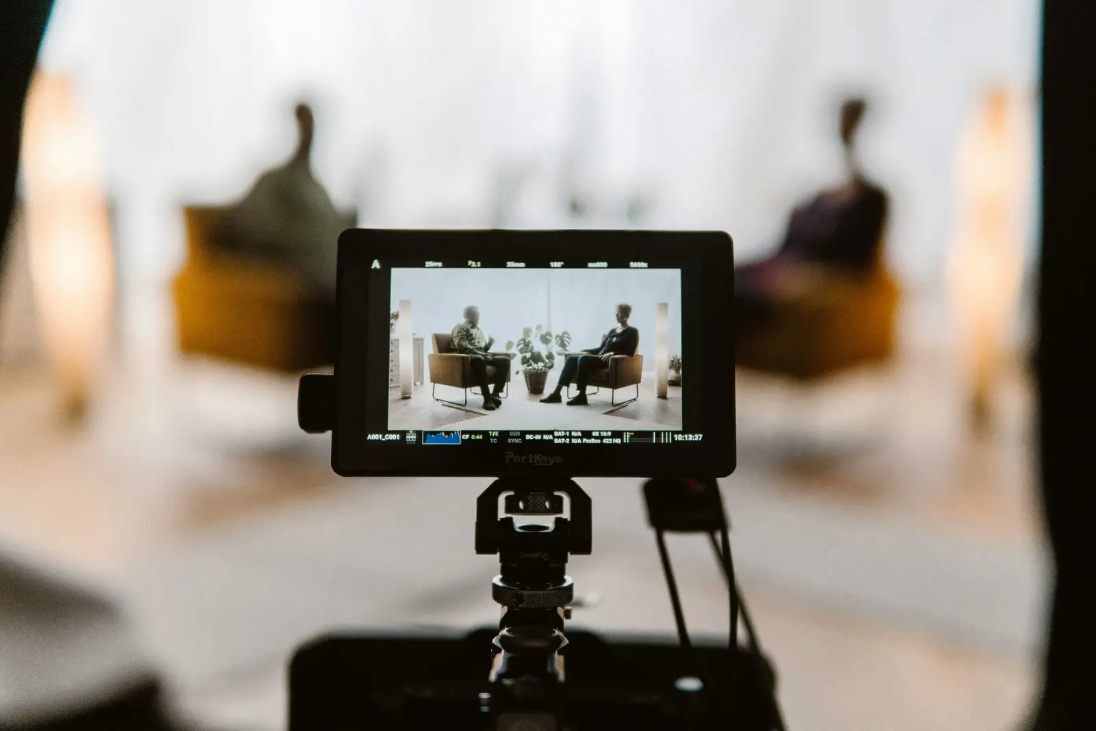 Camera monitor displaying an interview during a video shoot.